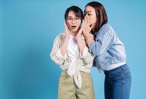 Two women on blue background photo