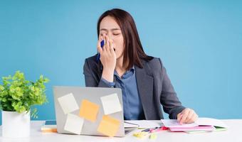 Young Asian businesswoman working on background photo