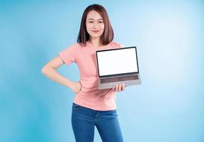 Asian woman on blue background photo