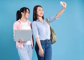 Two women on blue background photo