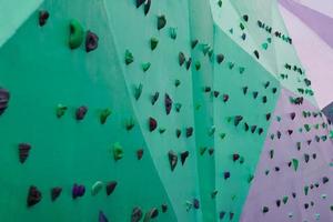 colorful rock climbing wall on the street photo