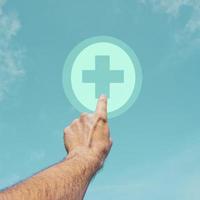 hand pointing at pharmacy icon, health insurance photo