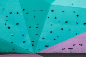 colorful rock climbing wall on the street photo