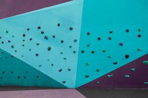 colorful rock climbing wall on the street photo