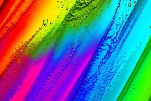 Abstract streaks of rainbow paint explosion ink pattern texture art paper photo