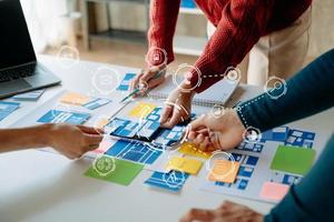 UX graphic designer planning application process development prototype wireframe for web smart phone. Creative digital development agency. photo