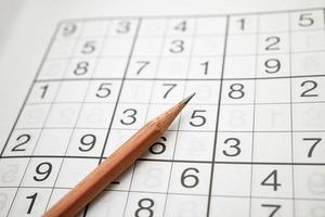 Sudoku puzzle, game to keep you brain younger for developing Alzheimer disease in senior patient. photo