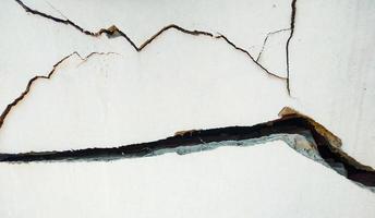 cracked exterior concrete wall  the impact of landslides, earthquakes, geology, low-standard construction photo