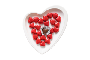 White heart plate with chocolates isolated on a transparent background png