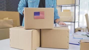 American flag on logistic cargo package. Cargo package with flag of America. video