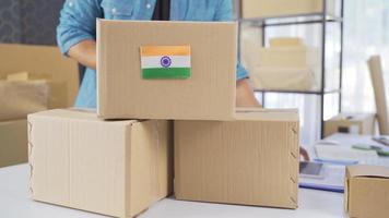 India flag on logistic cargo package. Cargo package with flag of India. video