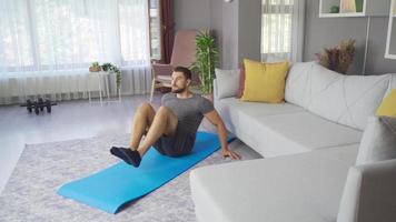 Mid adult fitness man exercising at home. Man exercises, burns fat, burns calories, strength training, home fitness. video