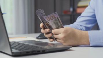 Office worker counting money. Man's hands counting US dollars. video