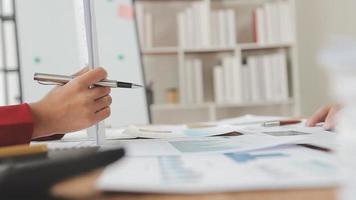 Financial analysts analyze business financial reports on a digital tablet planning investment project during a discussion at a meeting of corporate showing the results of their successful teamwork. video