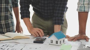 Construction and structure concept of Engineer or architect meeting for project working with partner and engineering tools on model building and blueprint in working site, contract for both companies. video