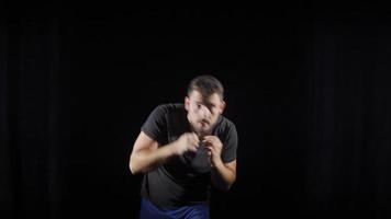 Professional boxer is training. Aggressive boxer doing shadow boxing. video