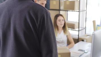 Entrepreneurs selling online are shipping customer orders. E-commerce. The couple, who sells online, delivers parcels and goods to cargo. video