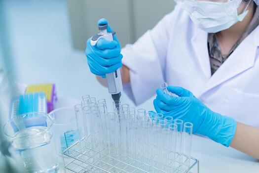 Asian scientist working in the lab,Doing experiment for product,The researchers analyzed to find the results of the experiment. photo
