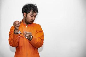 Portrait of prisoner on white background,Asian bad guy,The criminal was arrested by the police. photo