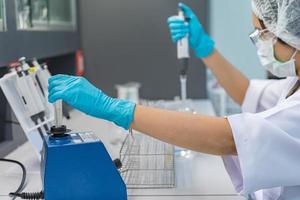 Asian scientist working in the lab,Doing experiment for product,The researchers analyzed to find the results of the experiment. photo