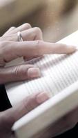 Vertical video close up of woman reading, 15s ready for social media stories