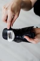 Hands cleaning women's  shoe photo