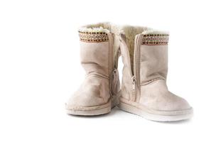 niños calentar invierno botas con piel aislado foto