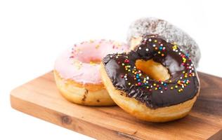 donut on wood block isolated photo