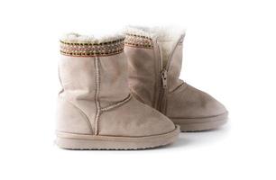 Kids warm winter boots with fur isolated photo