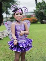 Cute cheerleader in violet bug costume. photo