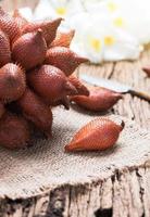 Salak fruit on wood background photo