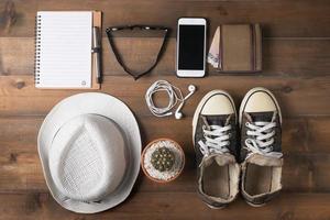 Travel preparations on wooden table photo
