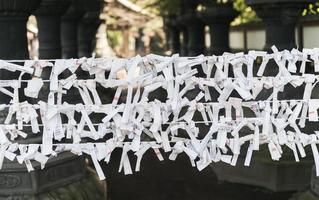 Japanese random fortunes written on strips of paper photo