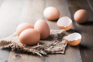 raw fresh egg on wood background photo