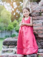 cute girl wearing red long dress. photo