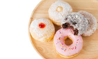 donut on wood block isolated photo