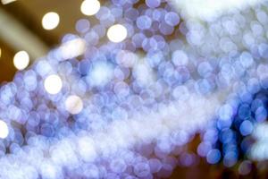 Abstract blurred and bokeh of led blue lighting refection in Christmas holiday background and textured. photo