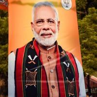 New Delhi, India - January 16 2023 - Prime Minister Narendra Modi cut out during BJP road show, the statue of PM Modi while attending a big election rally in the capital photo