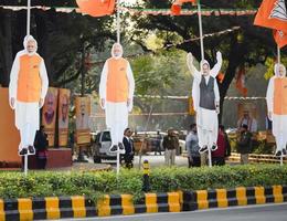 New Delhi, India - January 16 2023 - Prime Minister Narendra Modi cut out during BJP road show, the statue of PM Modi while attending a big election rally in the capital photo