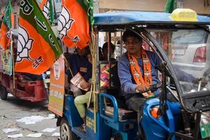 Delhi, India, December 02 2022 -Bharatiya Janata Party - BJP supporter during mega road show in support of BJP candidate Pankaj Luthara to file nomination papers ahead of MCD local body Elections 2022 photo