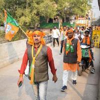 Delhi, India, December 02 2022 -Bharatiya Janata Party BJP supporter during mega road show in support of BJP candidate Pankaj Luthara to file nomination papers ahead of MCD local body Elections 2022 photo