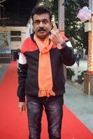 New Delhi, India - December 04 2022 - Unidentified people showing their ink-marked fingers after casting votes in front of polling booth of east Delhi area for MCD local body Elections 2022 photo