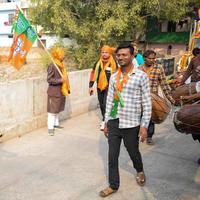 Delhi, India, December 02 2022 -Bharatiya Janata Party BJP supporter during mega road show in support of BJP candidate Pankaj Luthara to file nomination papers ahead of MCD local body Elections 2022 photo