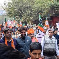 Delhi, India, December 02 2022 -Bharatiya Janata Party BJP supporter during mega road show in support of BJP candidate Pankaj Luthara to file nomination papers ahead of MCD local body Elections 2022 photo