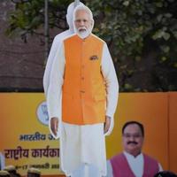 New Delhi, India - January 16 2023 - Prime Minister Narendra Modi cut out during BJP road show, the statue of PM Modi while attending a big election rally in the capital photo