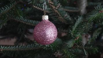 Christmas ball hanging on a christmas tree photo