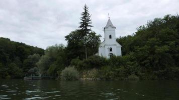 Storage reservoir Velka Domasa, church on the lake, river Ondava, Slovakia photo