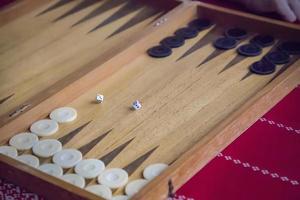 thrown dice on the table while playing backgammon photo