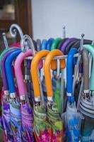 Day view of umbrellas with handles of different colors.  close-up photo
