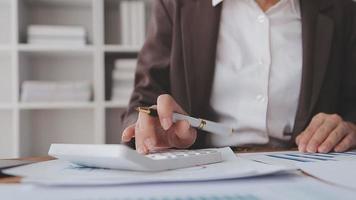 Financial analysts analyze business financial reports on a digital tablet planning investment project during a discussion at a meeting of corporate showing the results of their successful teamwork. video